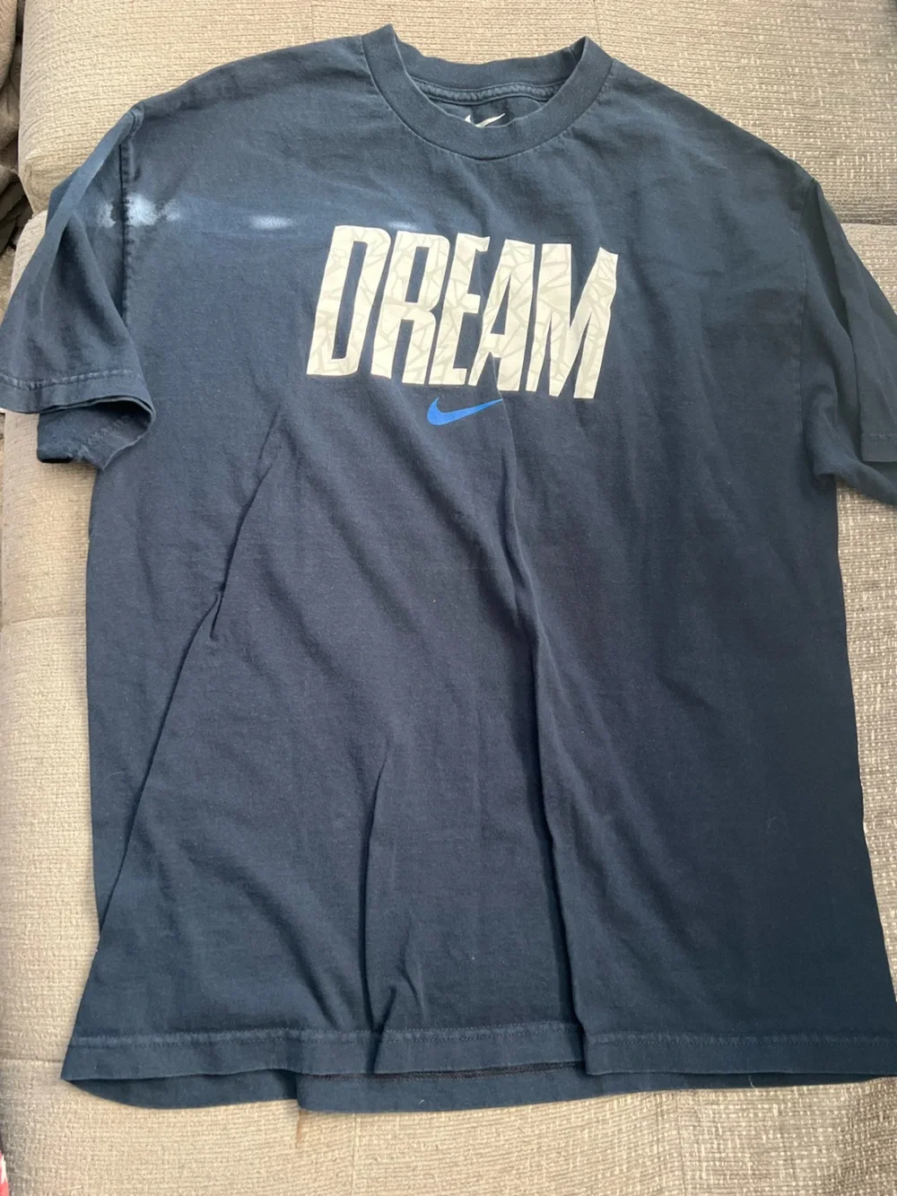 Nike Navy Short Sleeve Tee with White Vertical Graphic and Blue Swoosh. K24